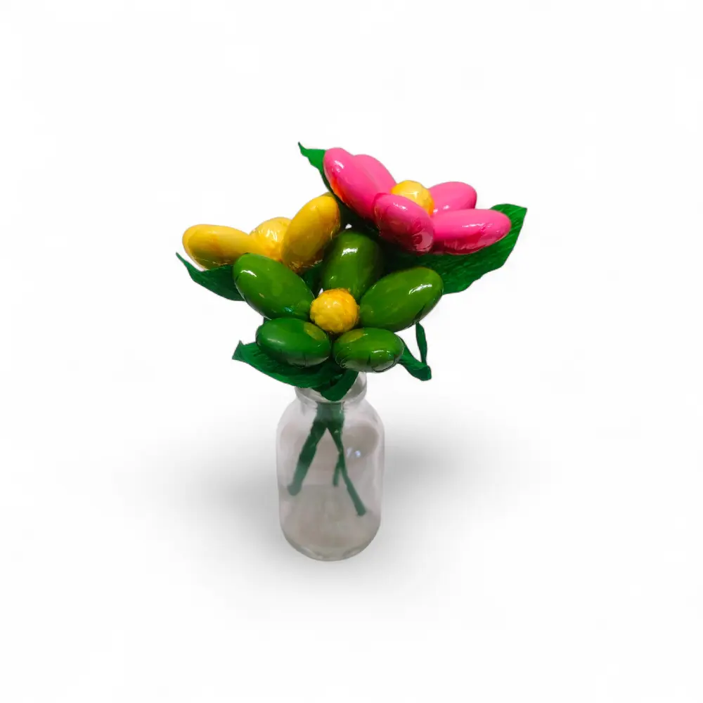 Bottle vase of flowers and chocolate candies