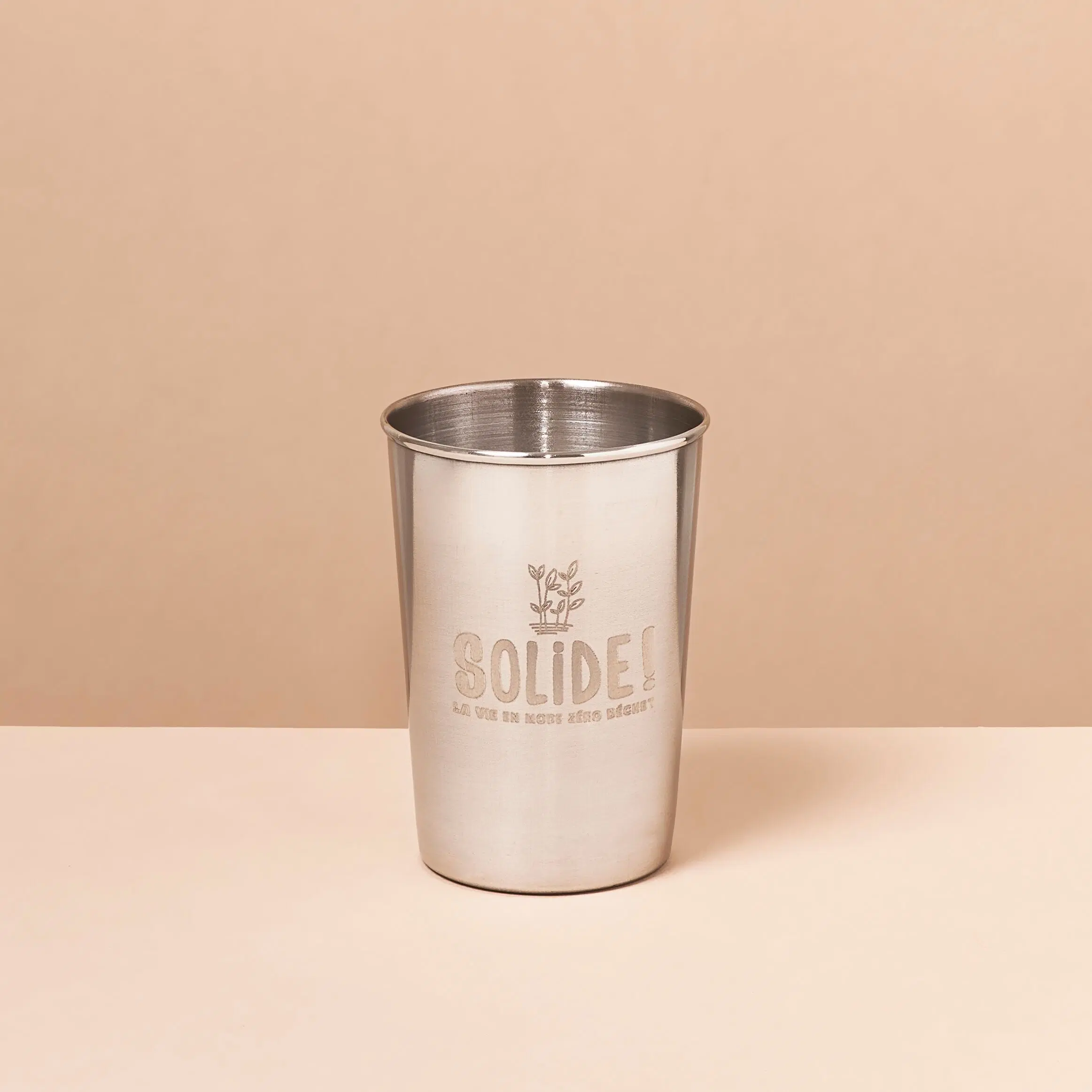 The stainless steel measuring cup with marking 120ml