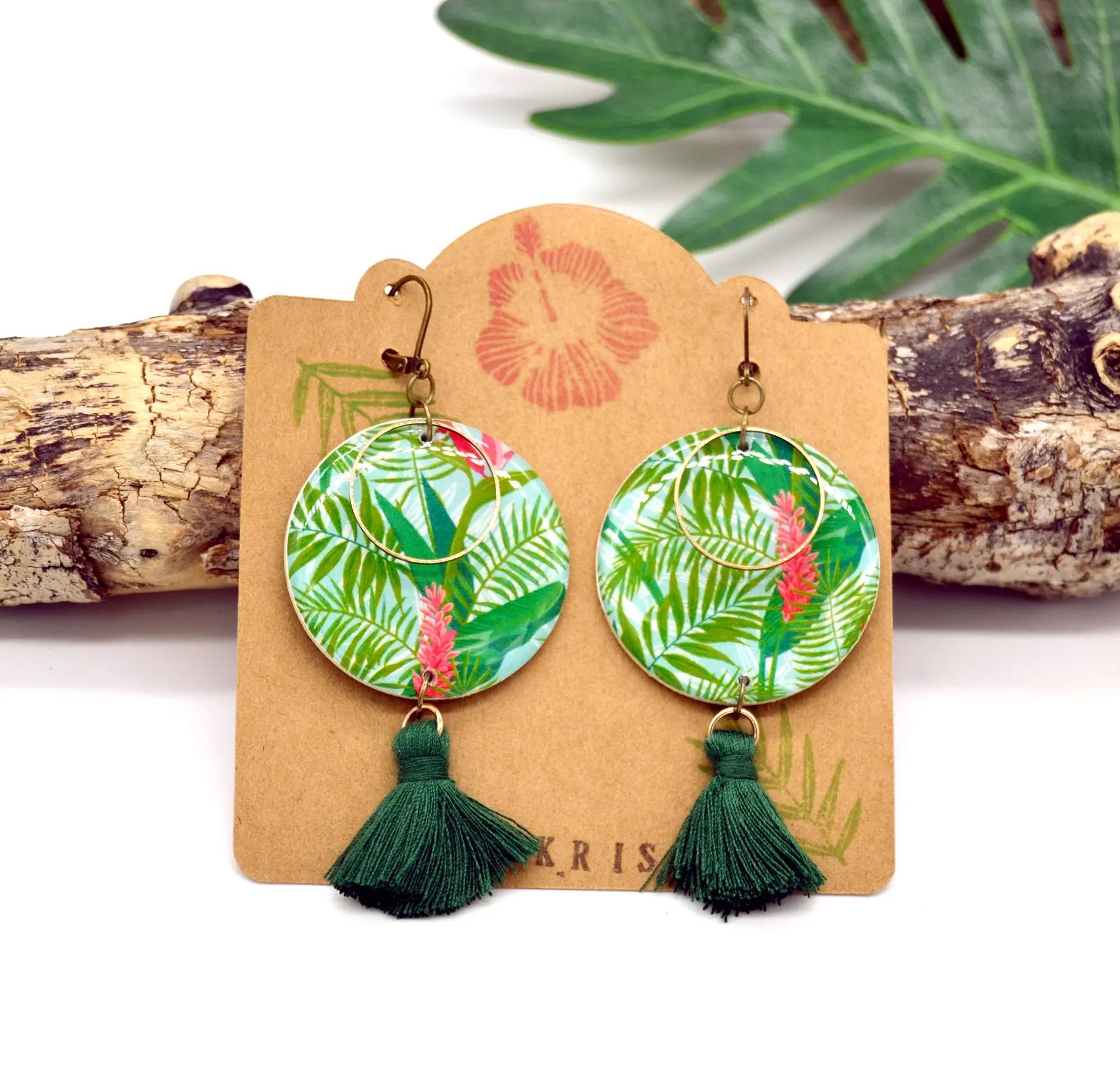 Paper resin earrings with tropical plant motif and green pompoms
