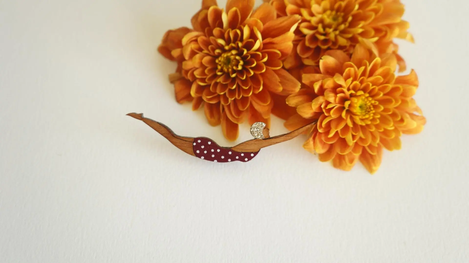 Wooden plunger brooch