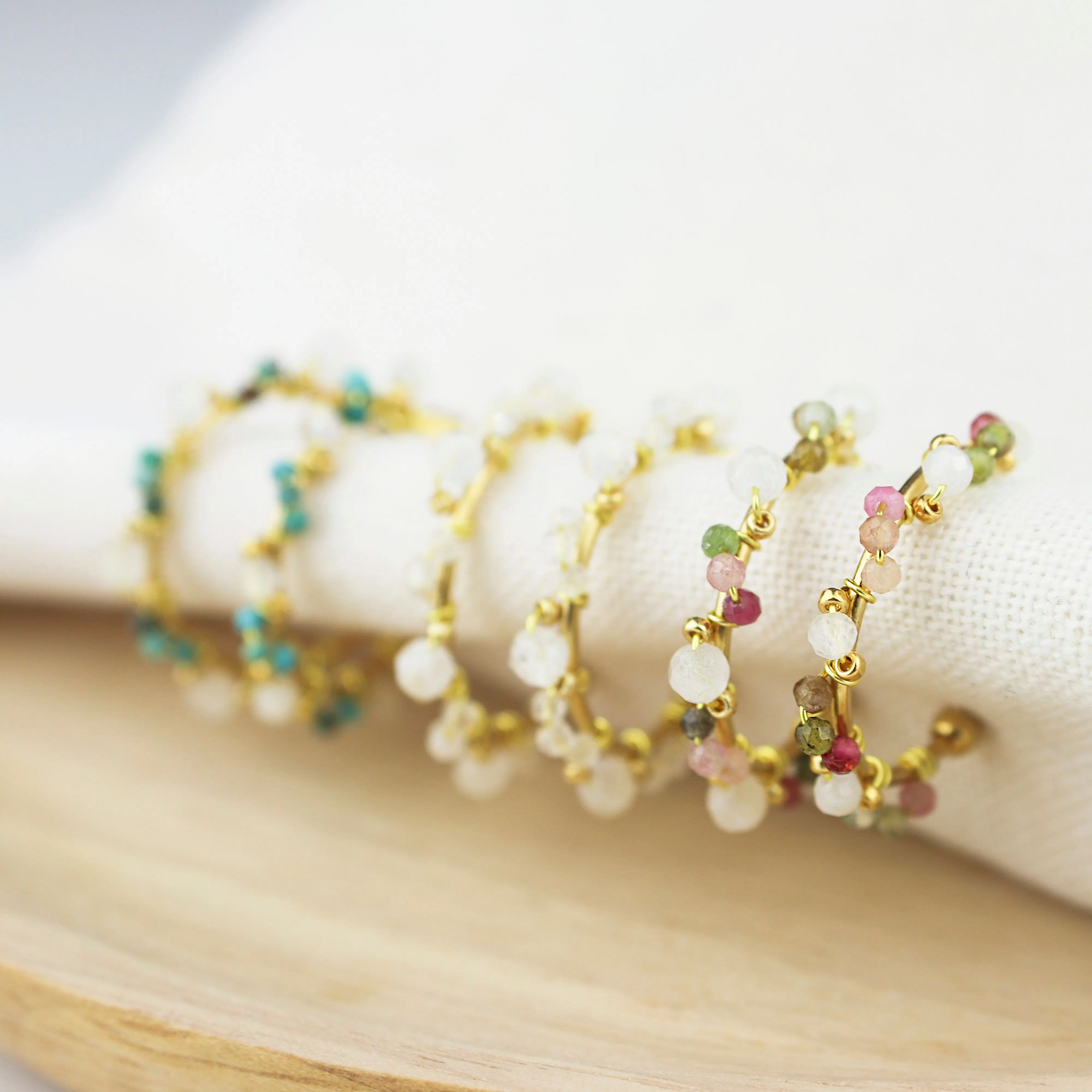 Gold and stone open hoop earrings
