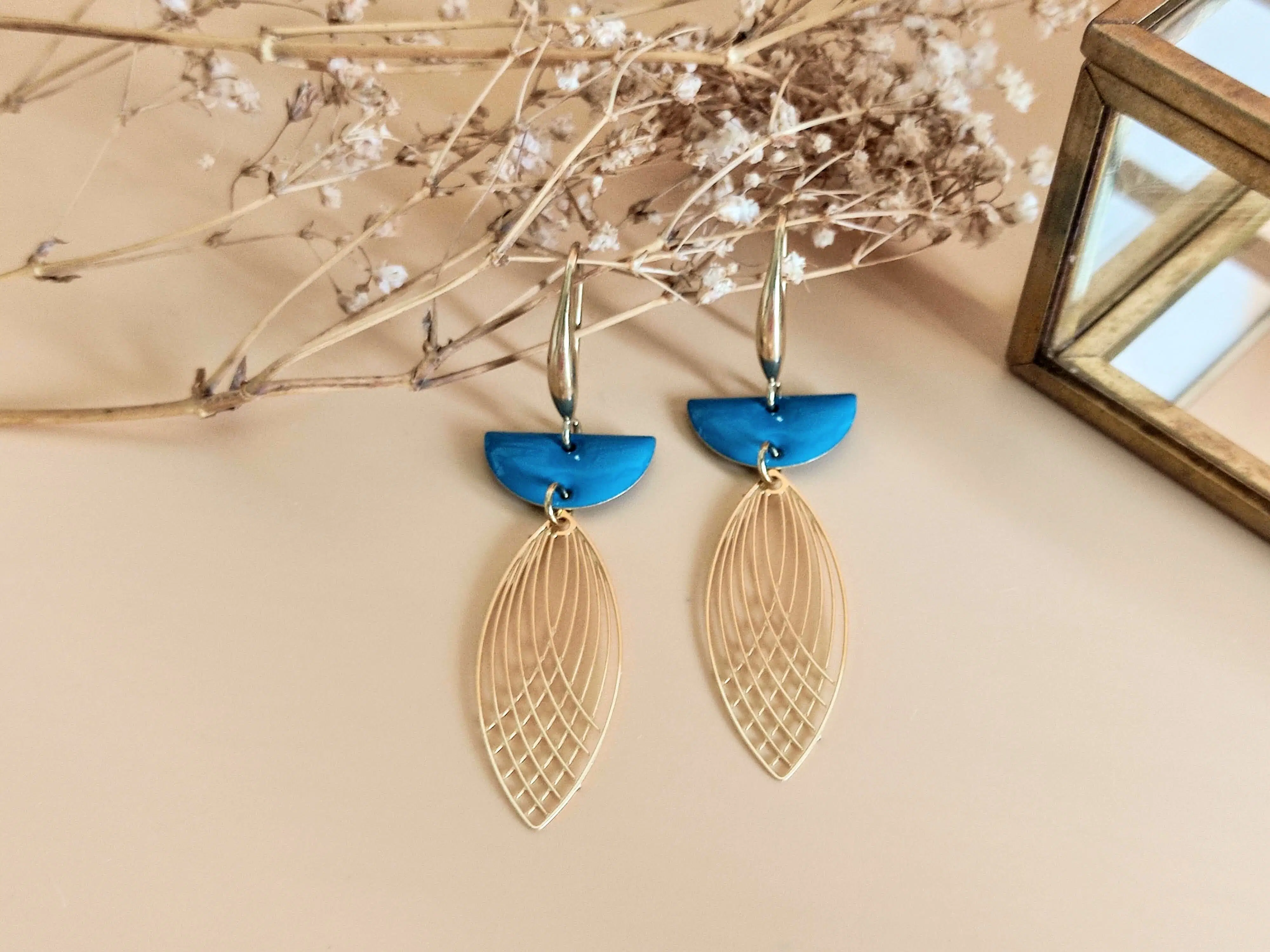 L'Audacieuse blue shuttle dangling earrings