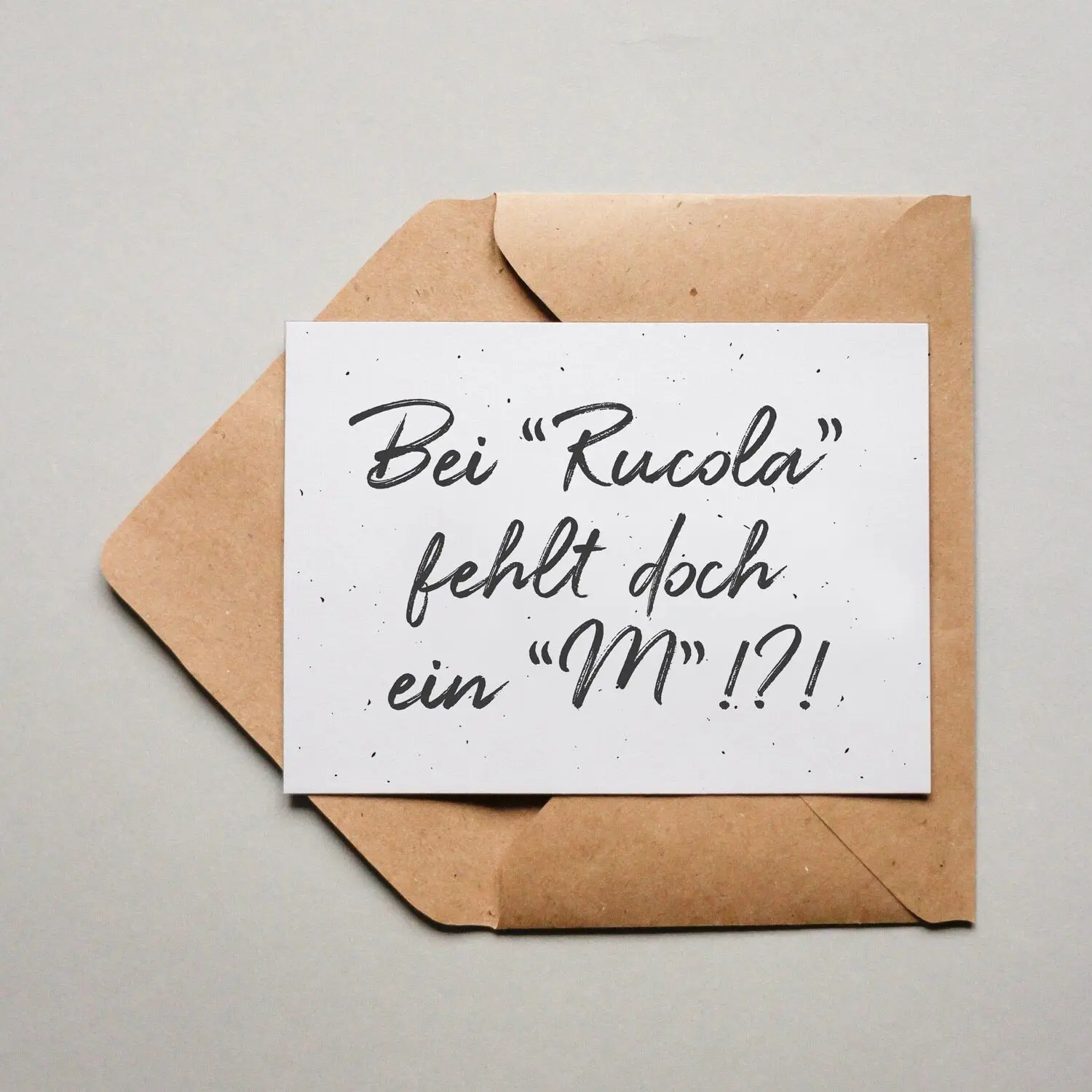 Postcard There’s an “m” missing in “Rucola”!?