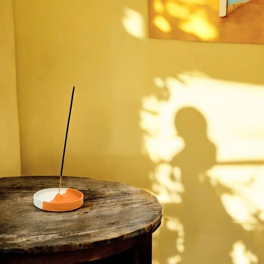 a sunny day incense holder - incense holder - ceramic - round - orange and white