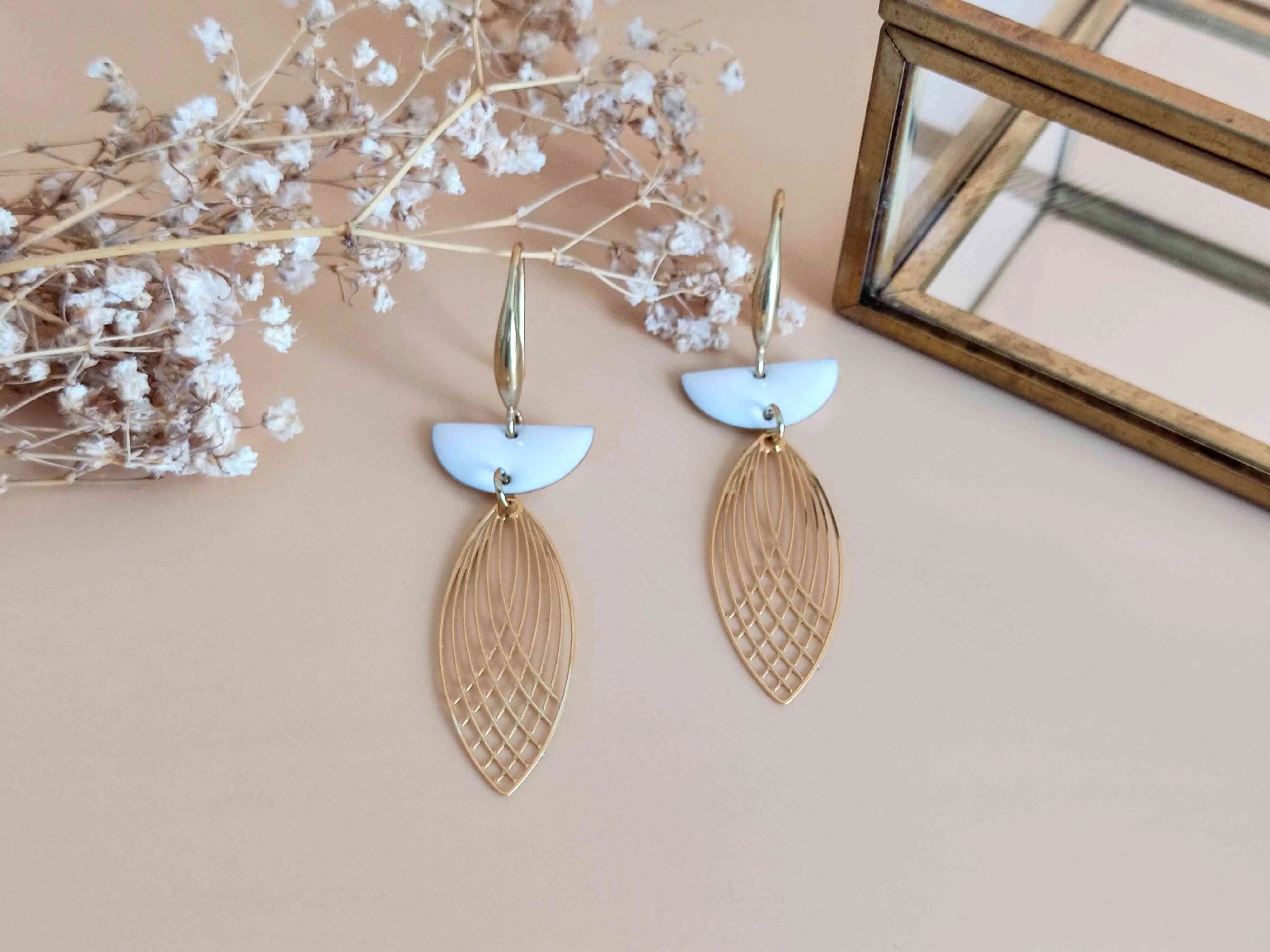 L'Audacieuse white shuttle drop earrings