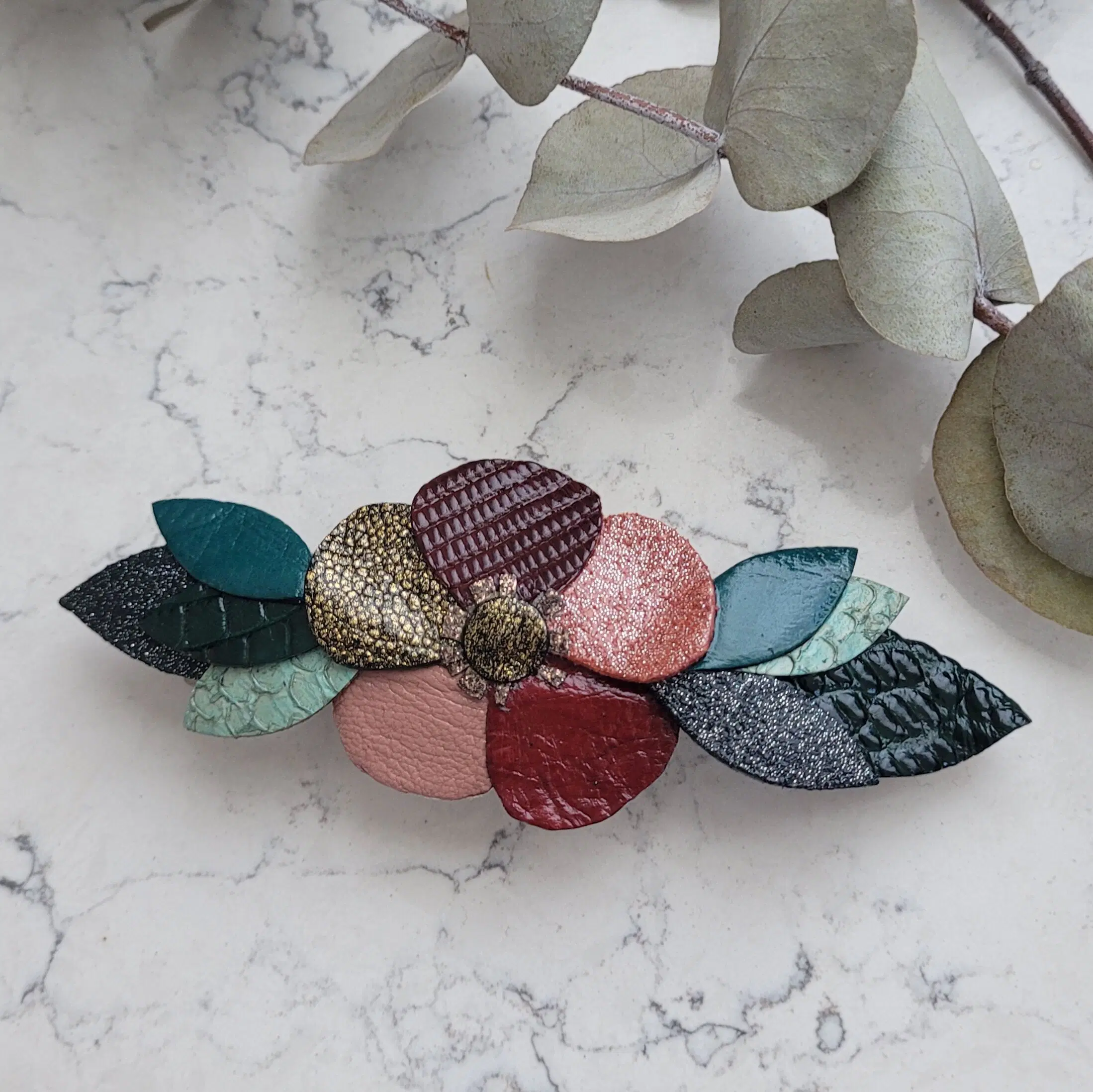 Leather flower barrette in burgundy, pink and green tones