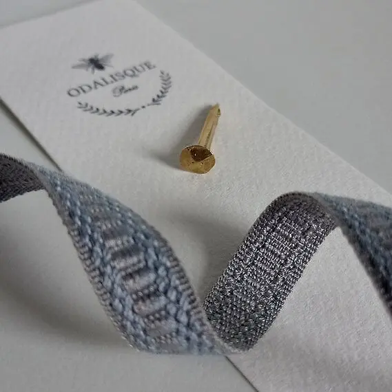 Hammered gold nail and grayish blue braid