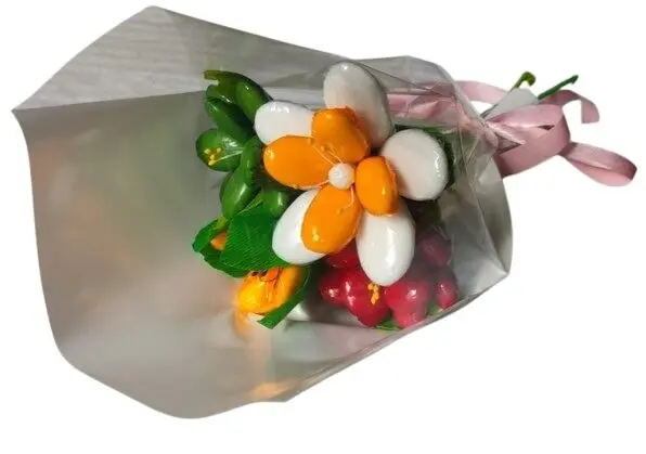 Mini bouquet of Tiare flower, tulip, peony, freesia in chocolate dragees
