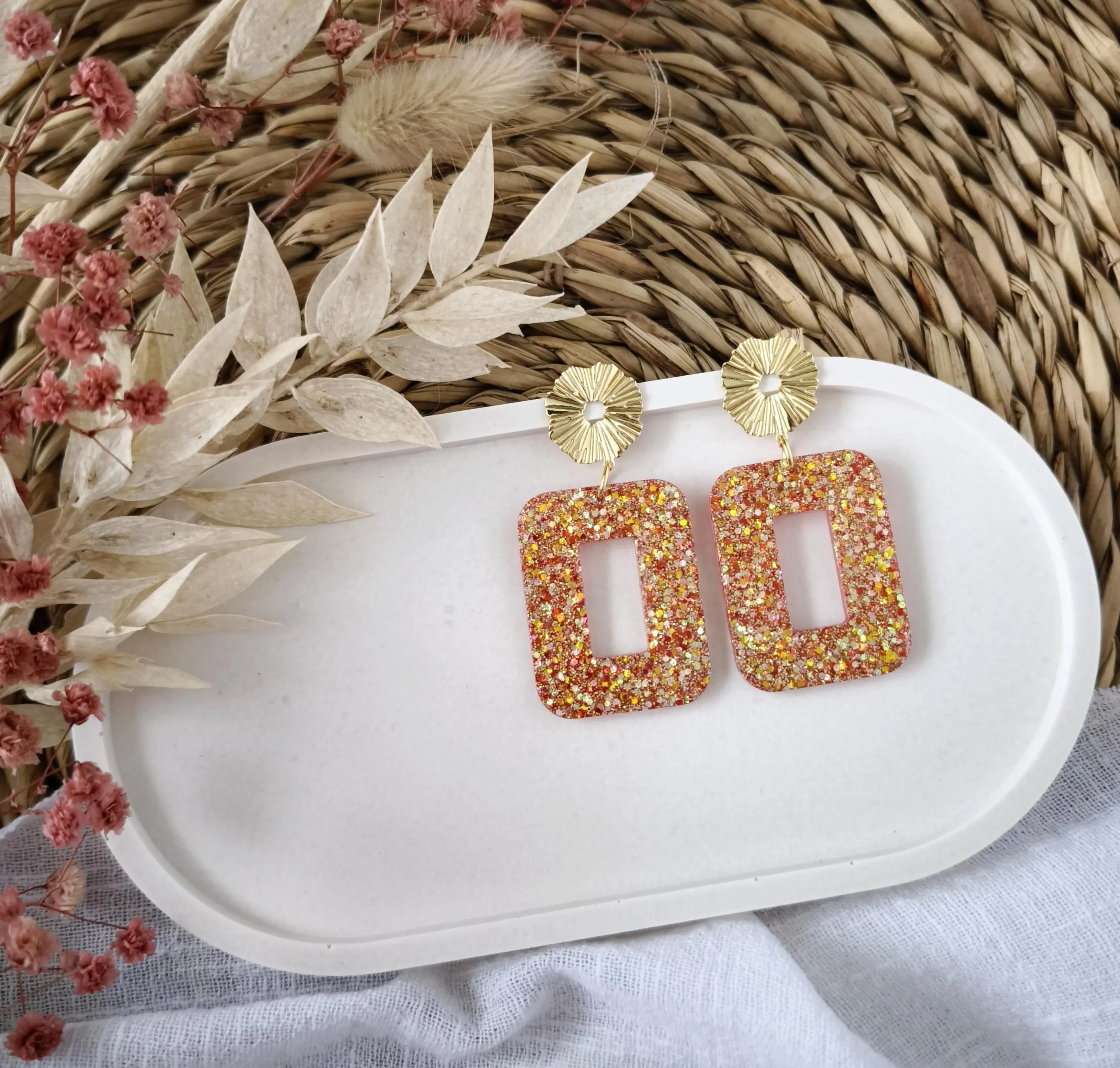 Red glitter earrings with shimmering highlights
