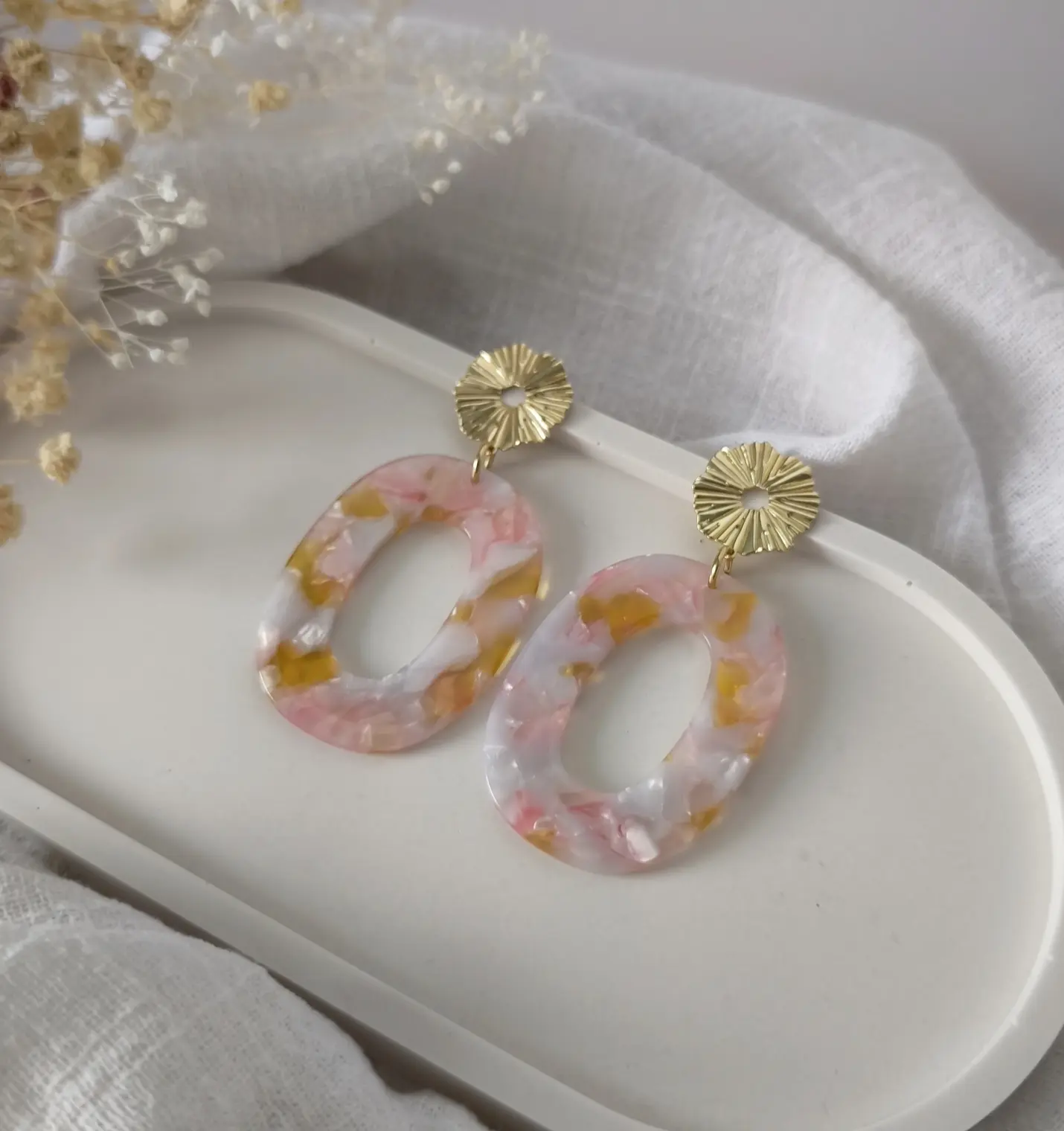 Oval marbled acrylic earrings in yellow/pink
