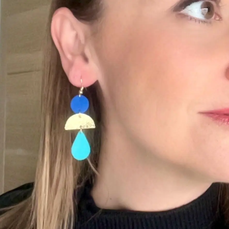 JOA model leather earrings in blue, gold, and turquoise