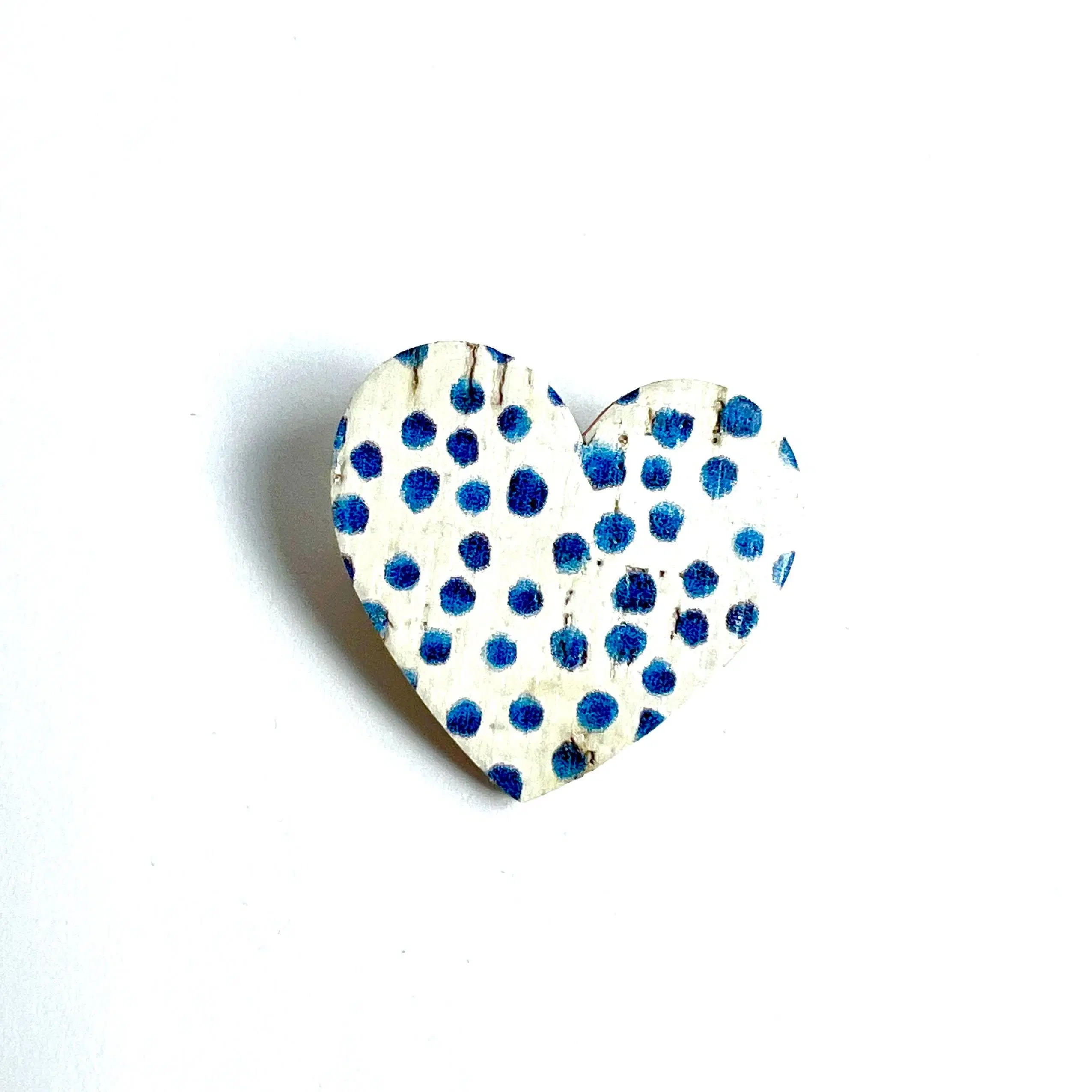 Heart brooch in cork and leather with blue polka dot pattern on a white background
