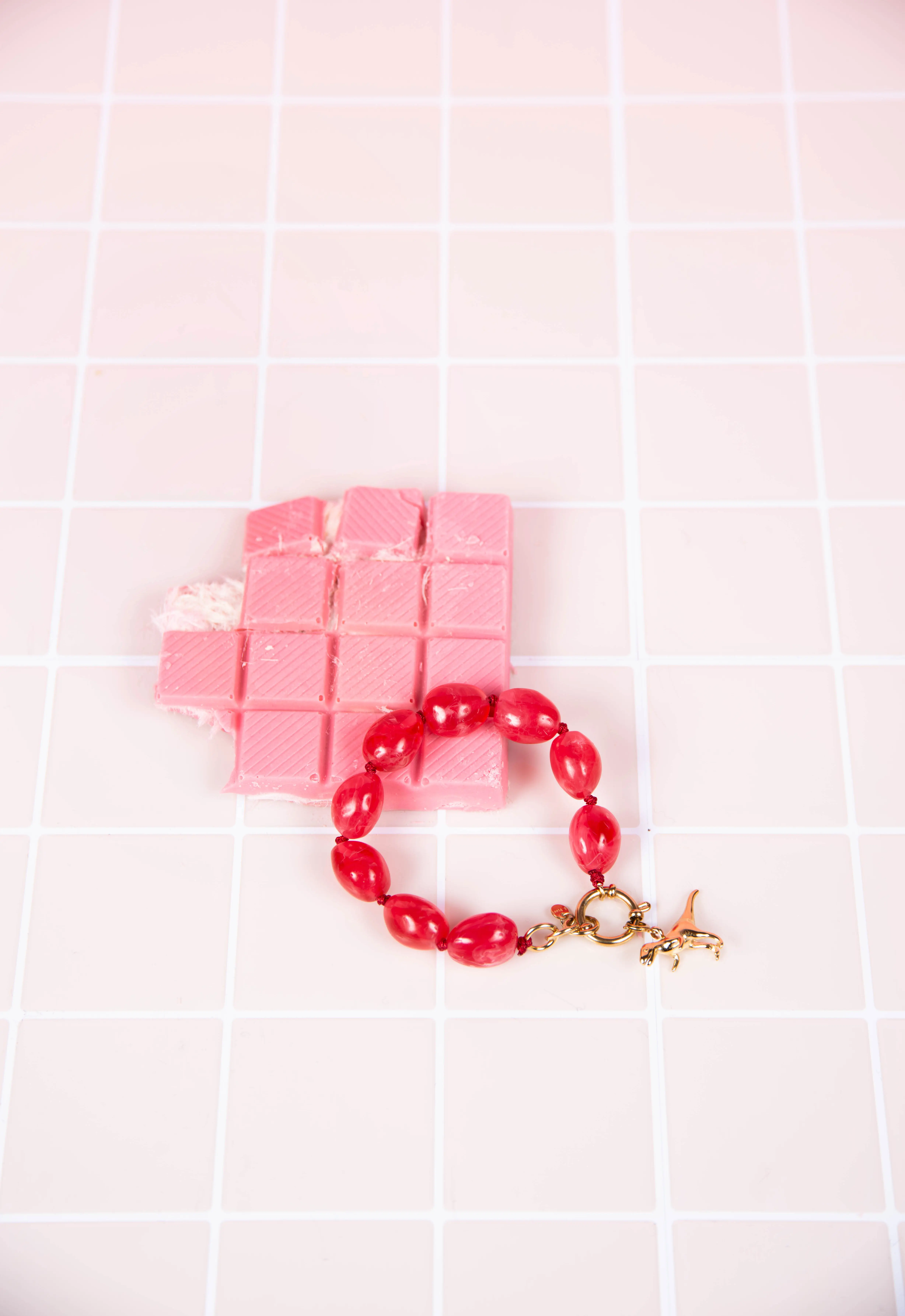 Pink resin bracelet - with dinosaur charms