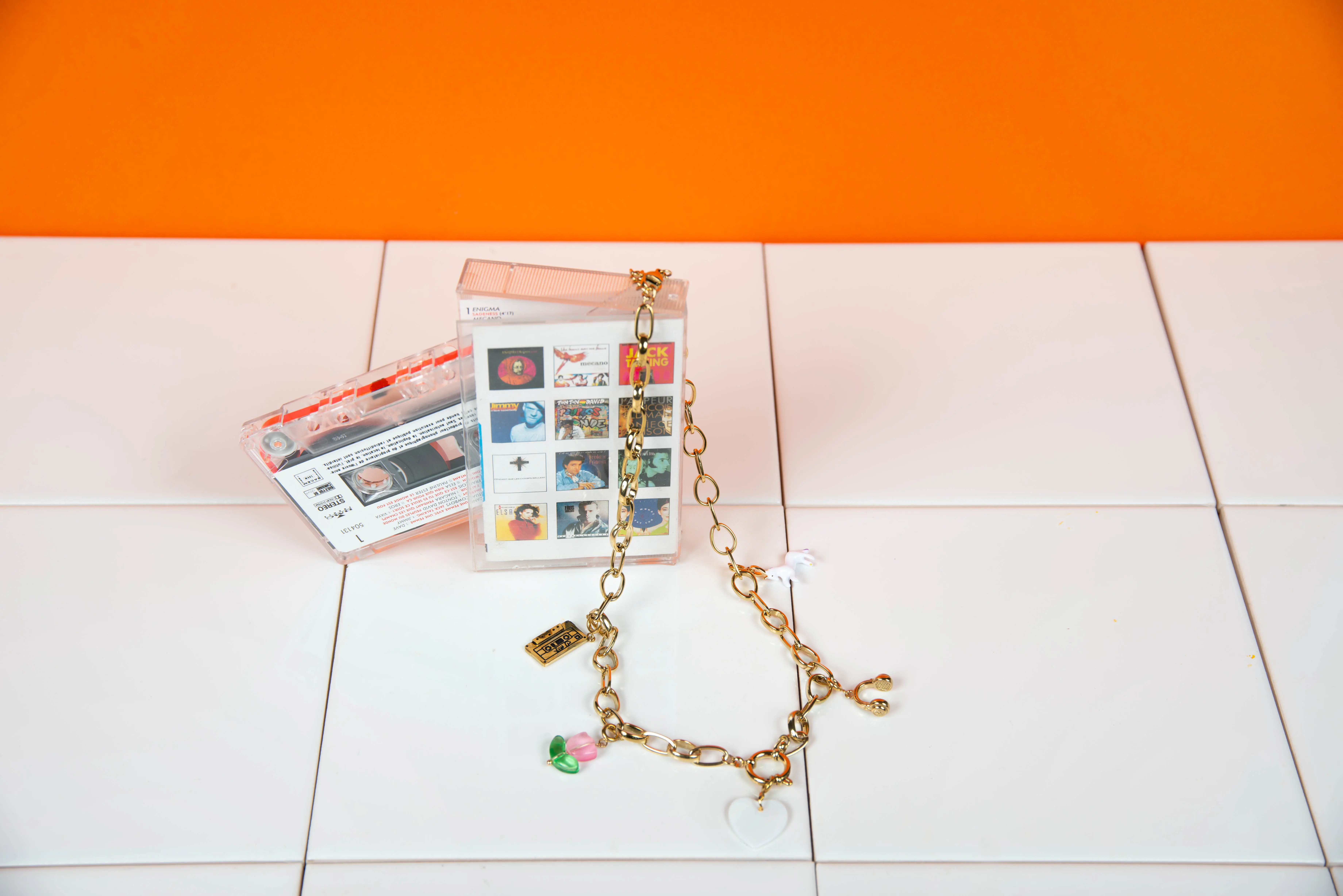 Stainless steel necklace with 5 charms.