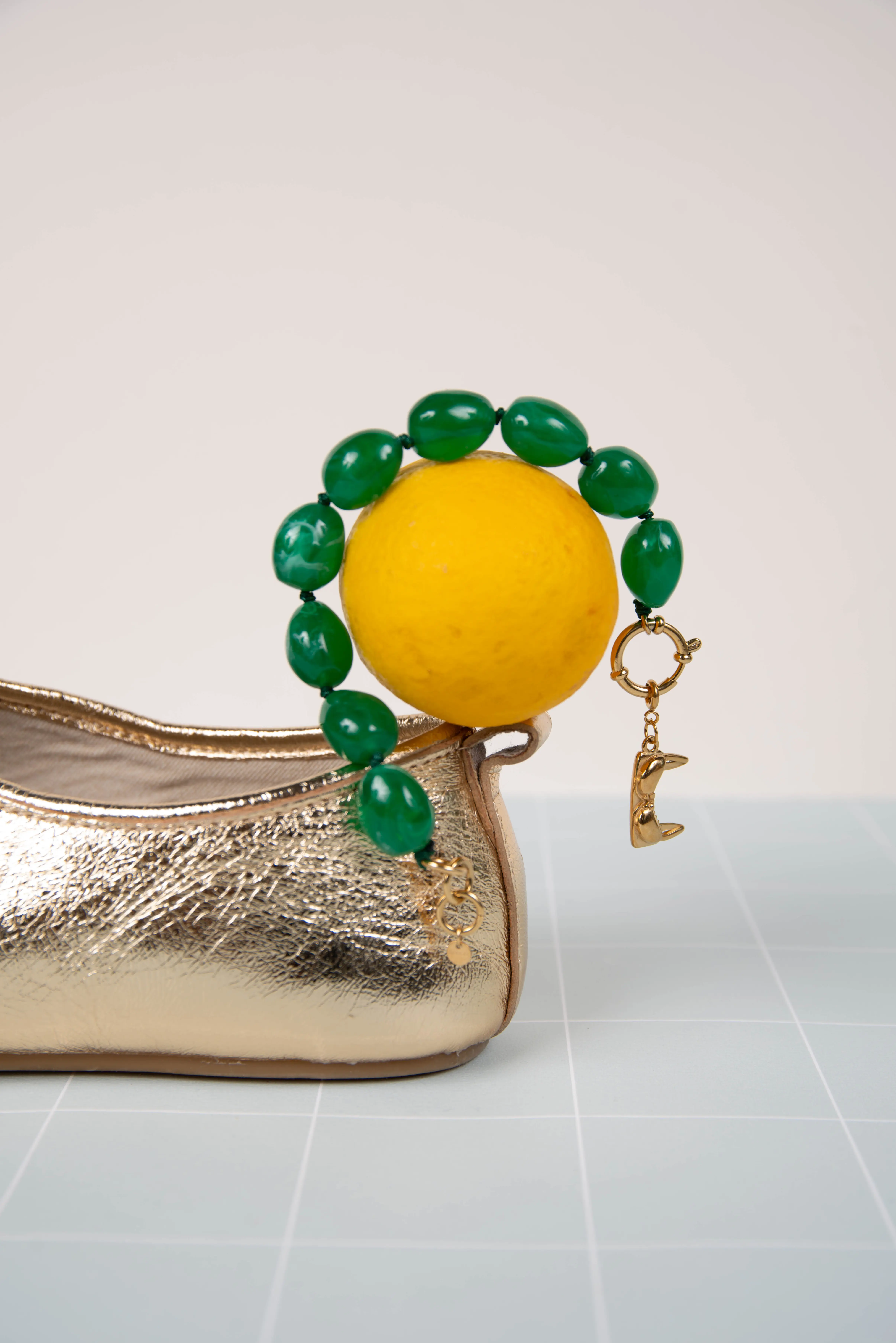 Green resin bracelet - with bra charms