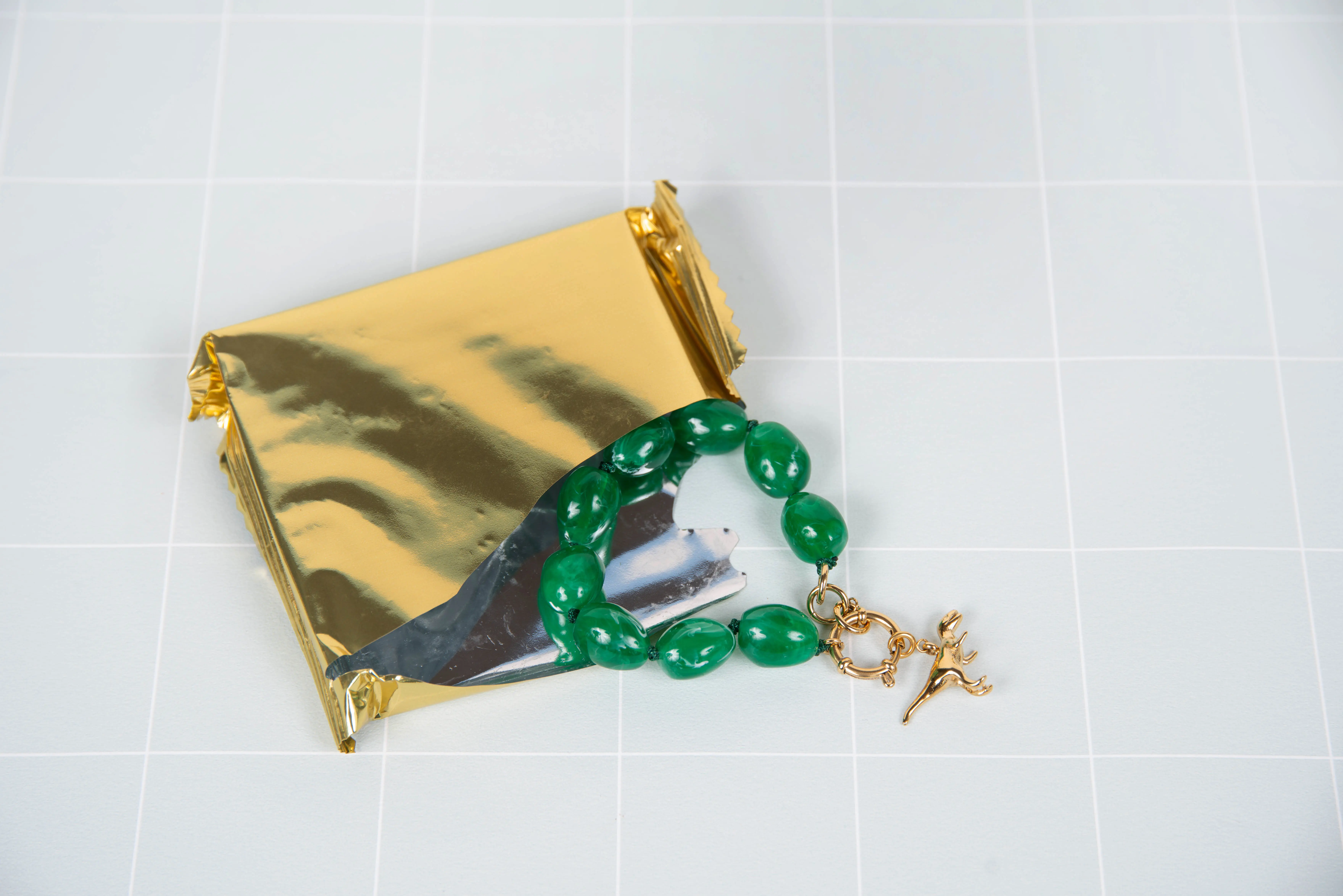 Green resin bracelet - with dinosaur charms