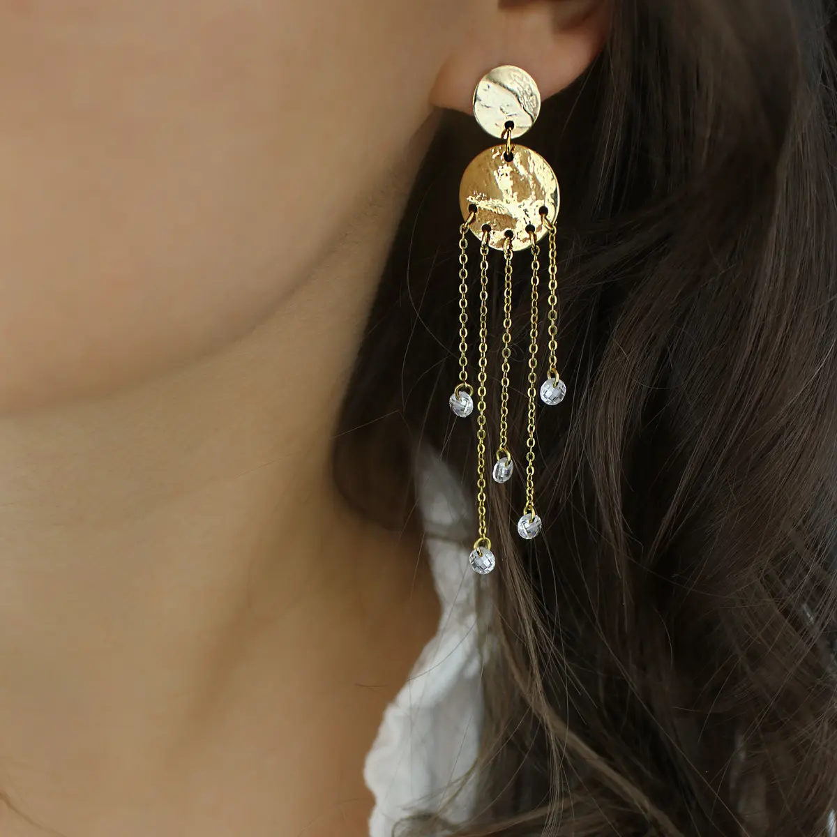 Long dangling earrings with hammered medallion