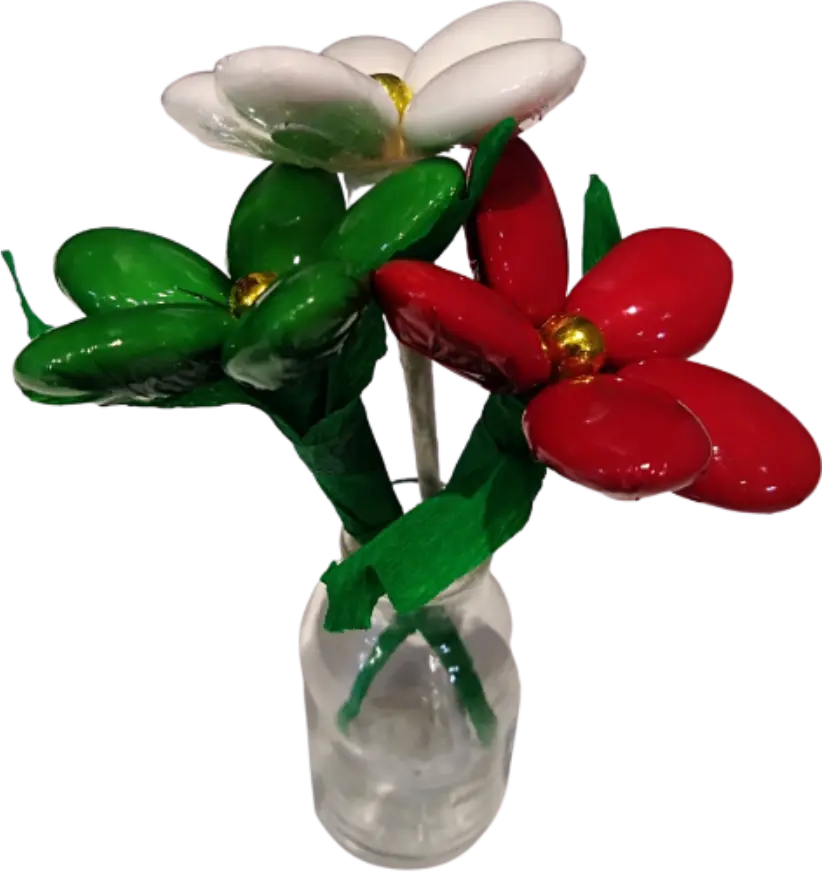 Christmas bottle vase with flowers, sugared almonds, and chocolate