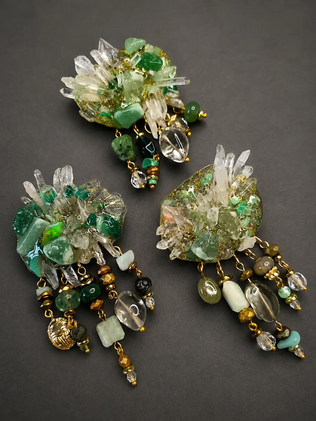 Set of three brooches with natural stones