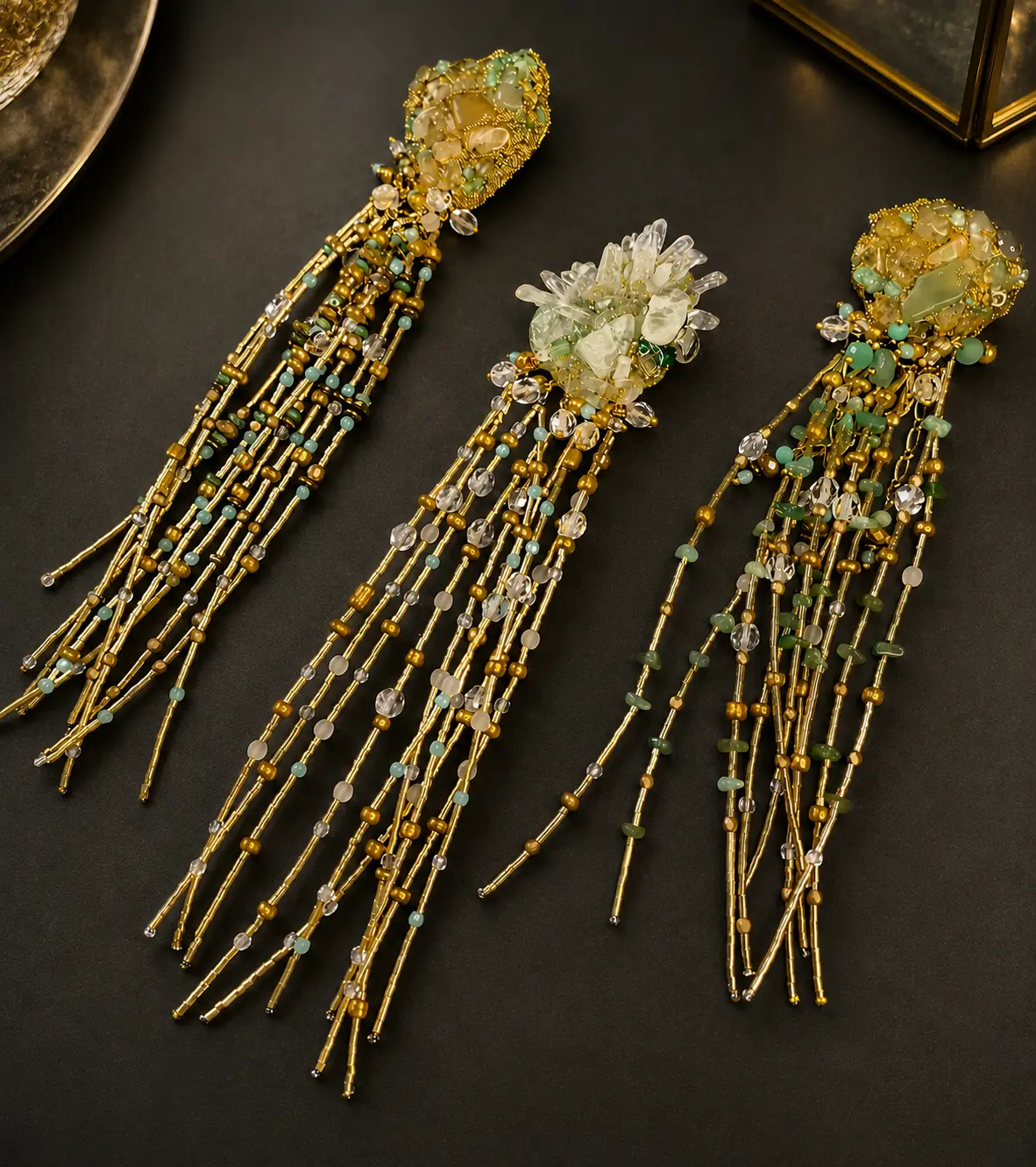 Set of three brooches with natural stones