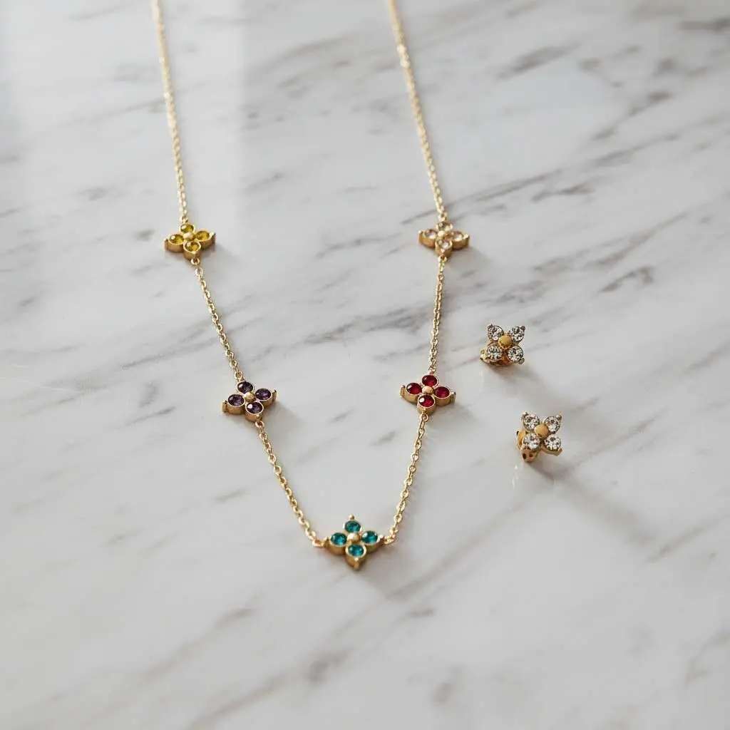 Jewelry set: Necklace with beaded leaves, cubic zirconia, and earrings in 18K gold PVD-plated stainless steel, waterproof.