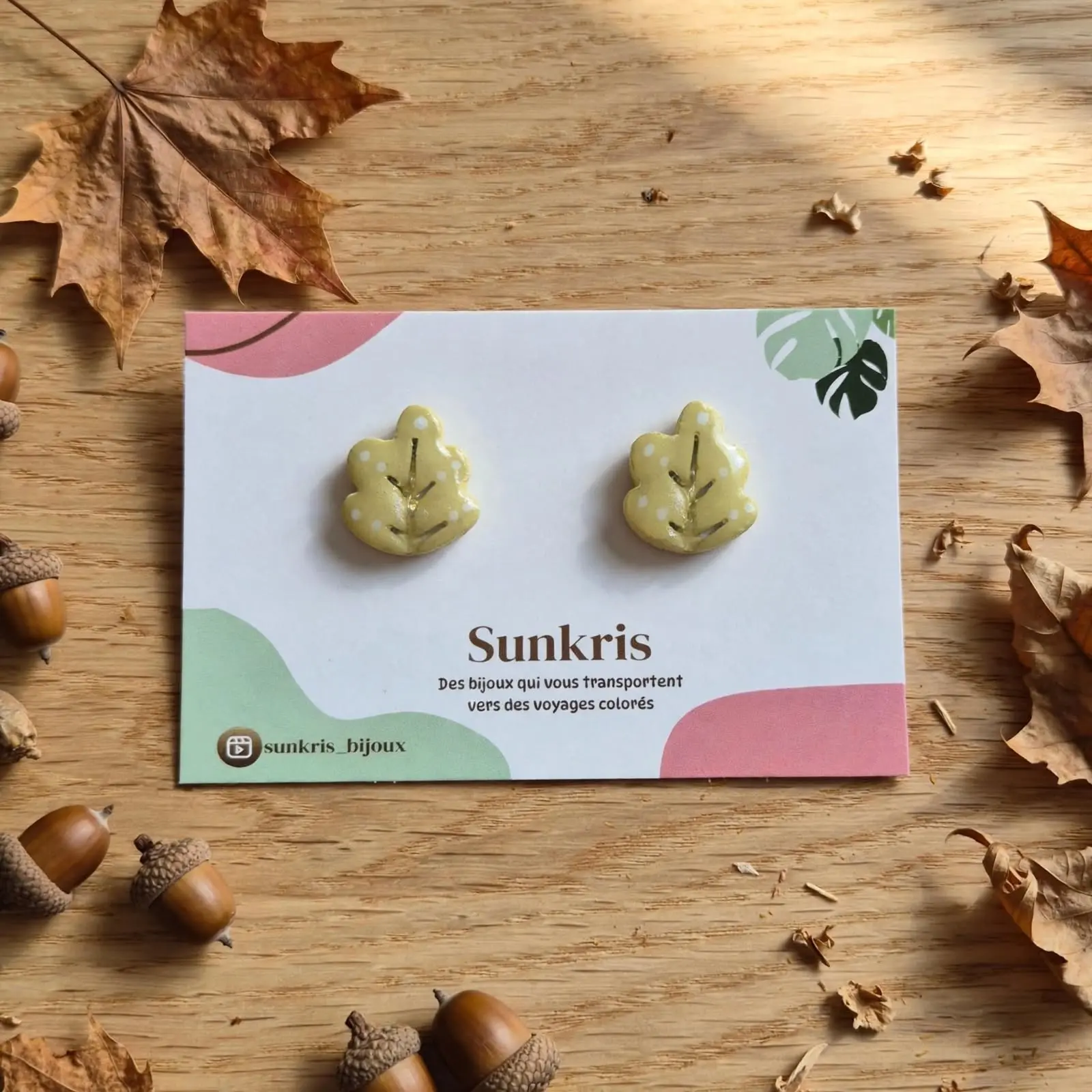 Light green oak leaf earrings with polka dots in clay