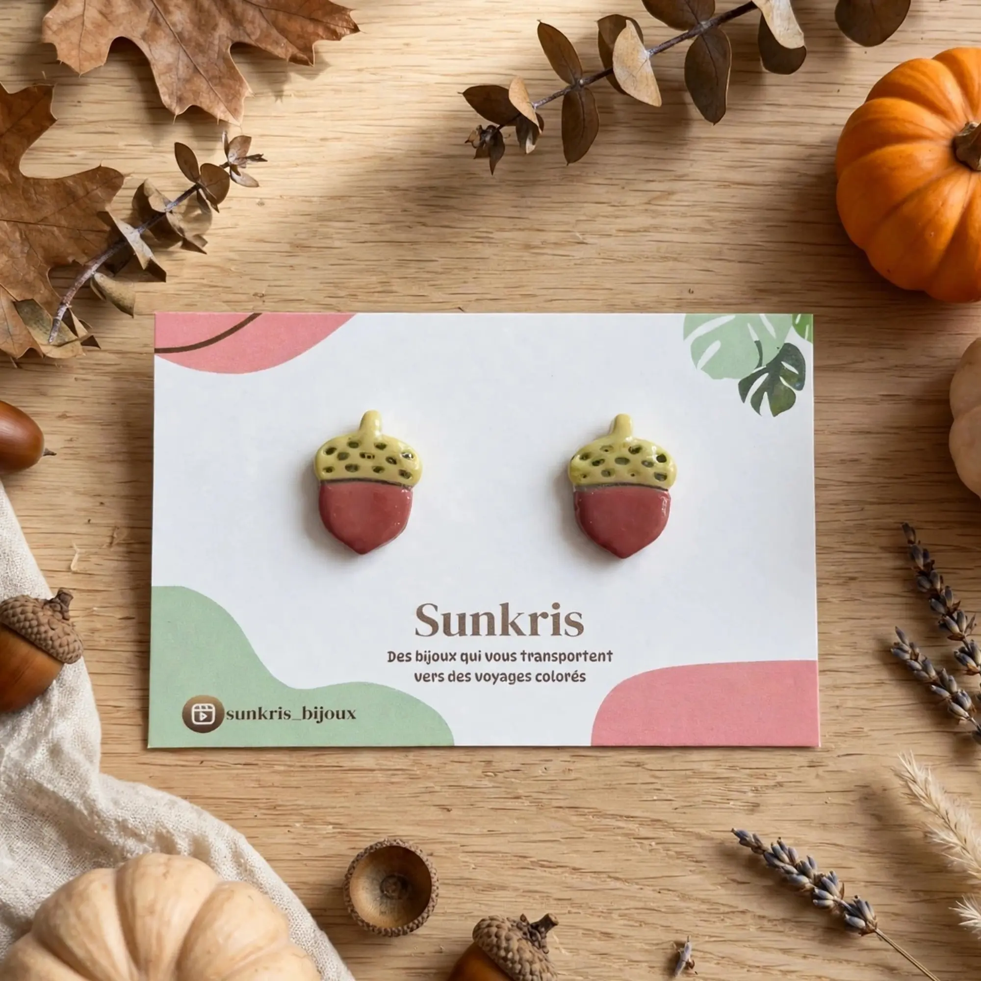 Light green and terracotta acorn earrings in clay